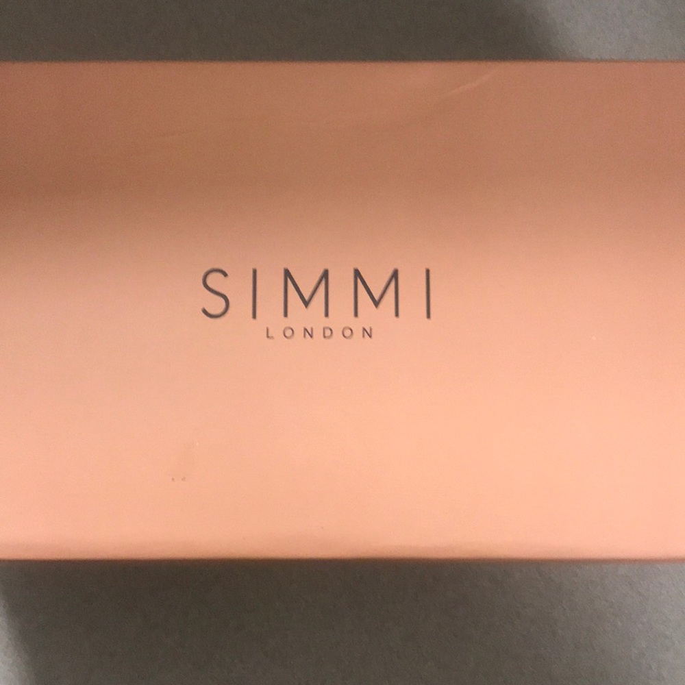 Clear black mule heels with gold heel.